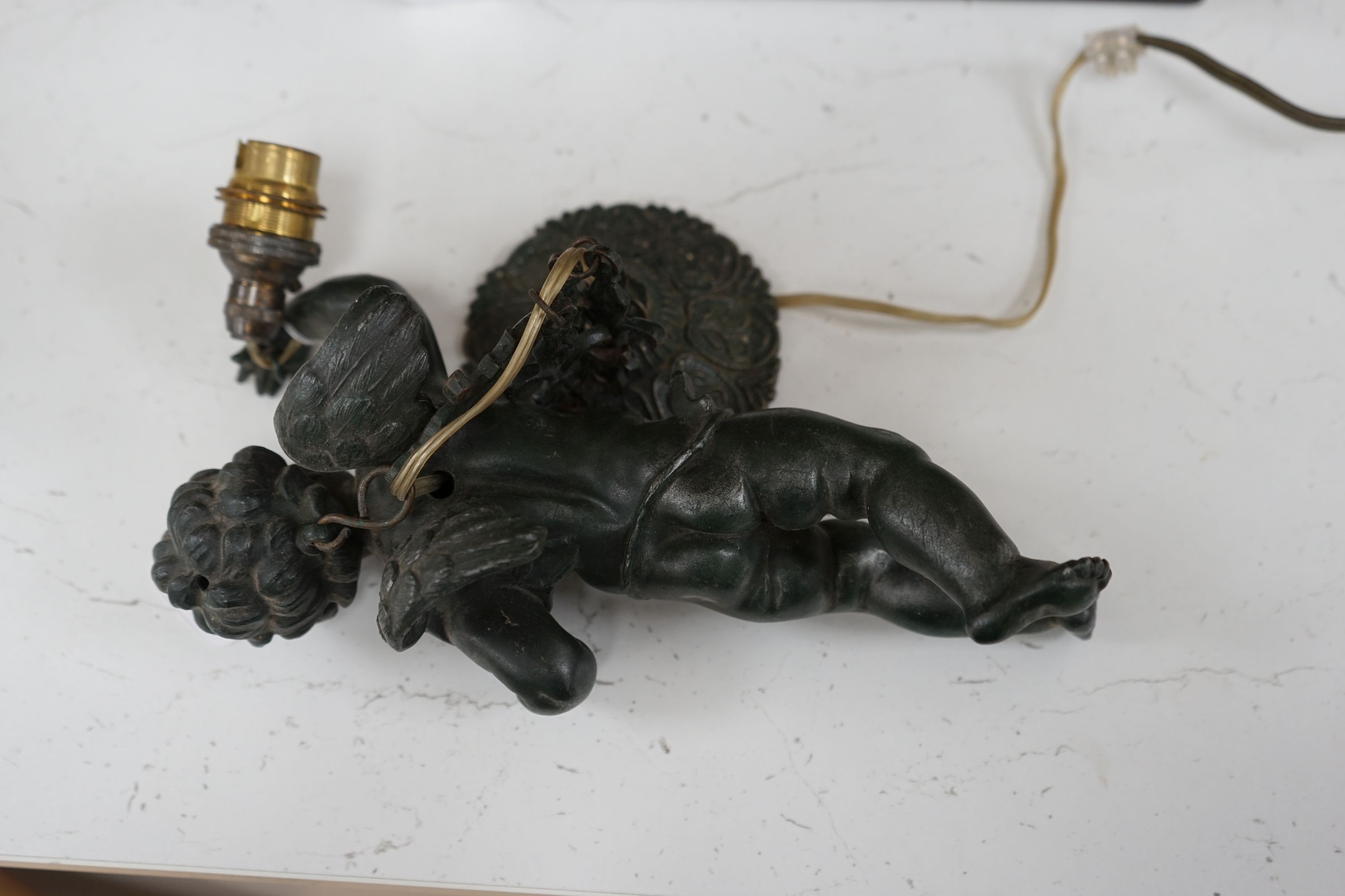 A bronzed spelter putti hanging light